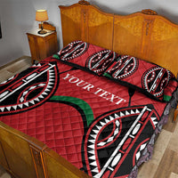 Red quilt bed set with large black-and-white tribal print, green accents, YOUR TEXT
