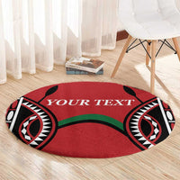 Red round rugby carpet with tribal motifs and 'YOUR TEXT' across center