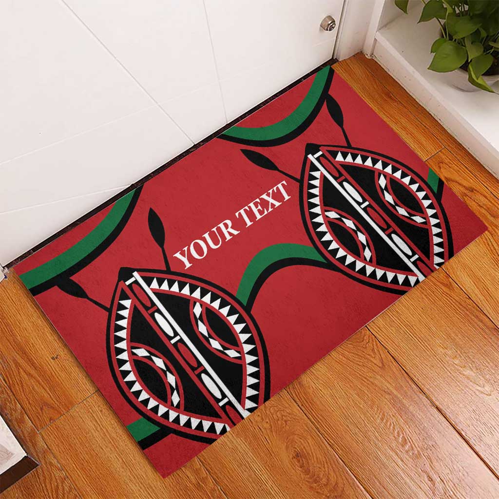 Red rubber doormat with 'YOUR TEXT' and tribal eye motifs along a hallway corner