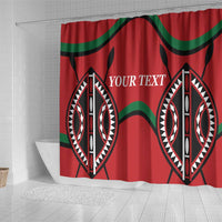 Red shower curtain with green bands and 'YOUR TEXT' between two black-and-white shields