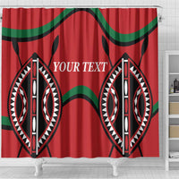 Red shower curtain with green wavy bands and 'YOUR TEXT' over two symmetrical shield motifs