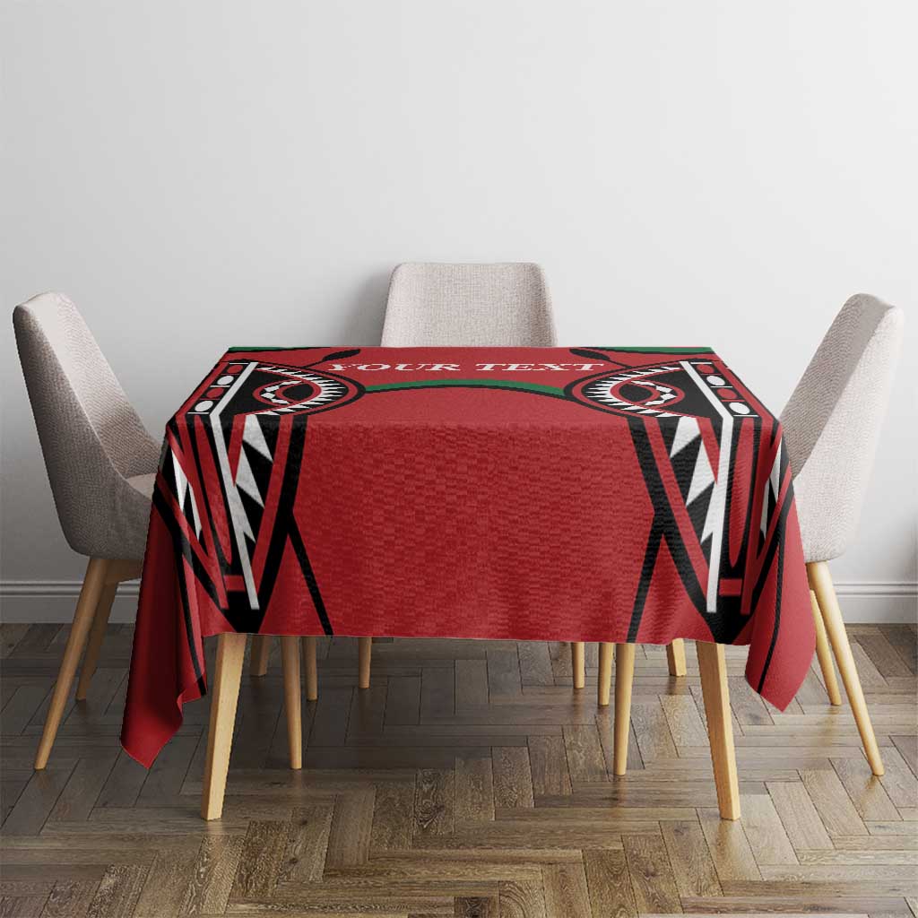 Red rugby-themed tablecloth on rectangular table with patterned black-and-green edges