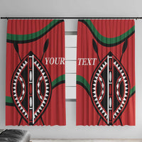 Pair of red window curtains with black tribal oval print and green curved stripe details