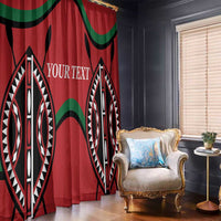 Red window curtain panels with black and white tribal design and green curved accents