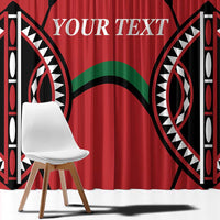 Red window curtain panel with black and white tribal geometric print and green accents