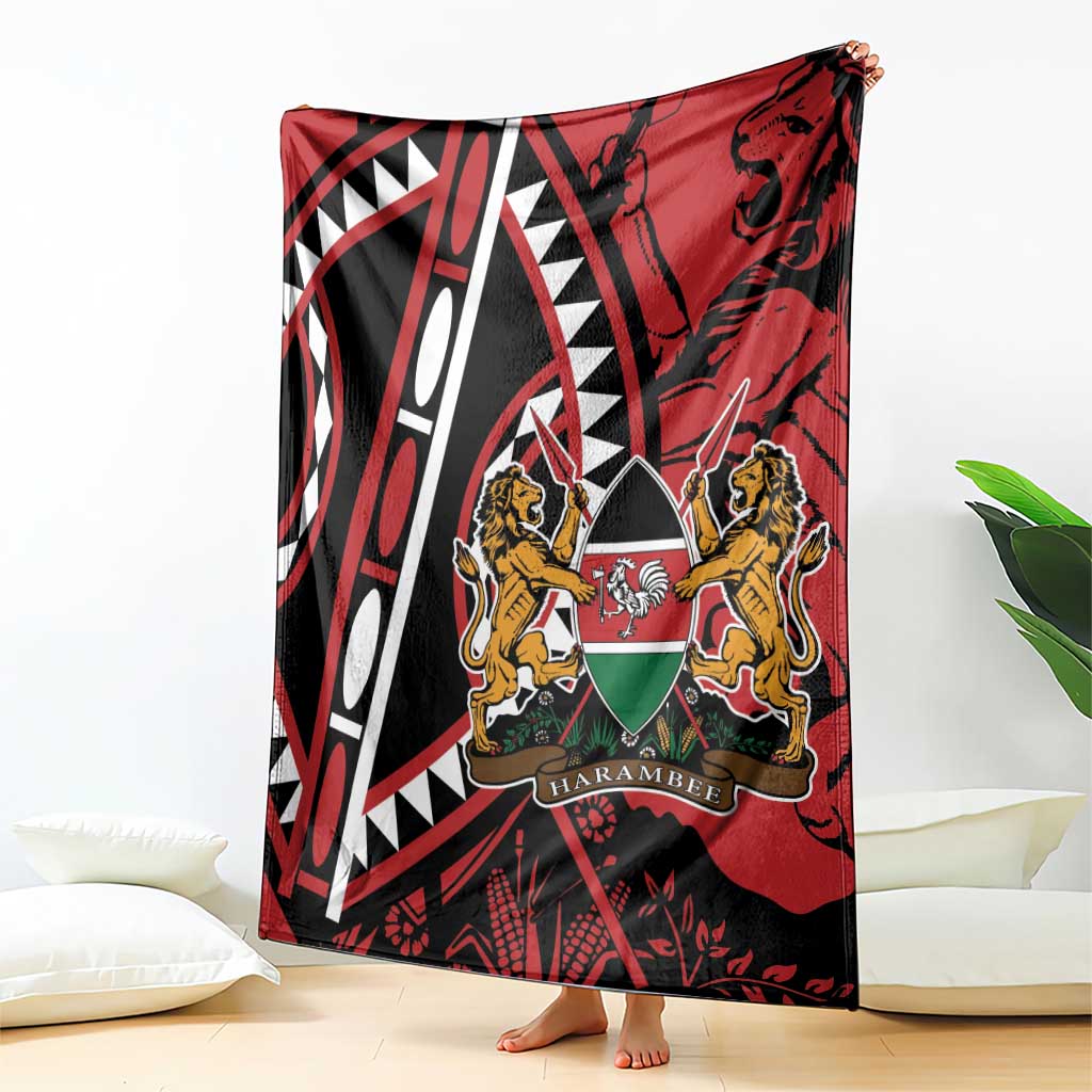 Red and black blanket with white geometric lines and lions crest, draped on bed