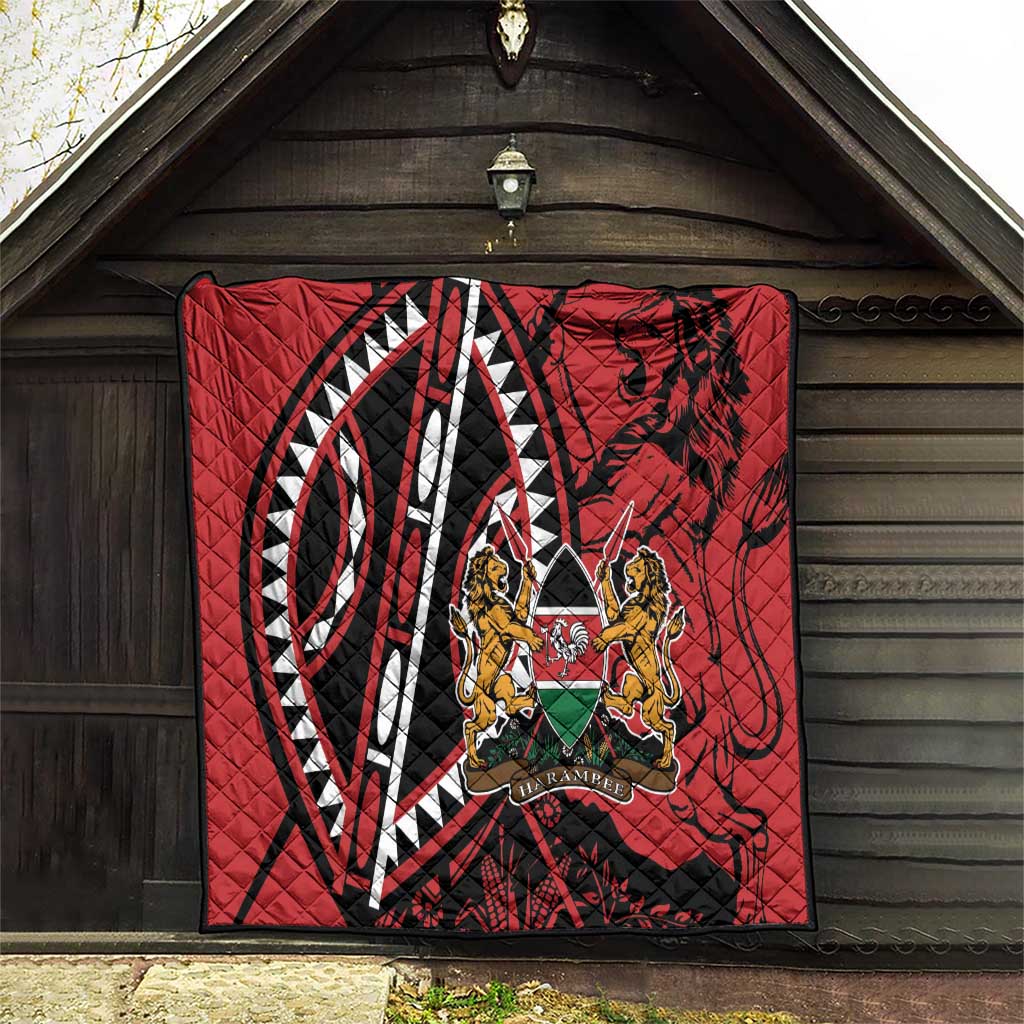 Red quilt hanging on wooden wall with geometric stripes and Harambe crest