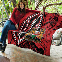Red quilt blanket with black-and-white design and Harambe crest