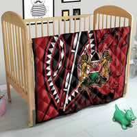 Red quilt blanket with bold black-and-white pattern and Harambe shield