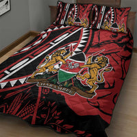 Red, black and white quilt bed set with illustrated animals, shield emblem, and two pillows
