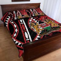 Red, black and white quilt bedspread featuring geometric stripes, lions, and shield emblem