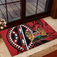 Red rubber doormat at doorway with lion shield crest and tribal ring design