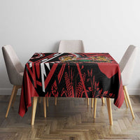 Red and black rectangular tablecloth with crest and bold geometric pattern