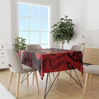 Red and black tablecloth with African shield design on dining set