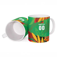 Ceramic mug with green tropical print, includes large "00" on front and open top view