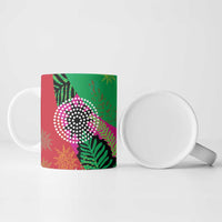 Ceramic mug with pink and green tropical graphic and leafy accents, white interior