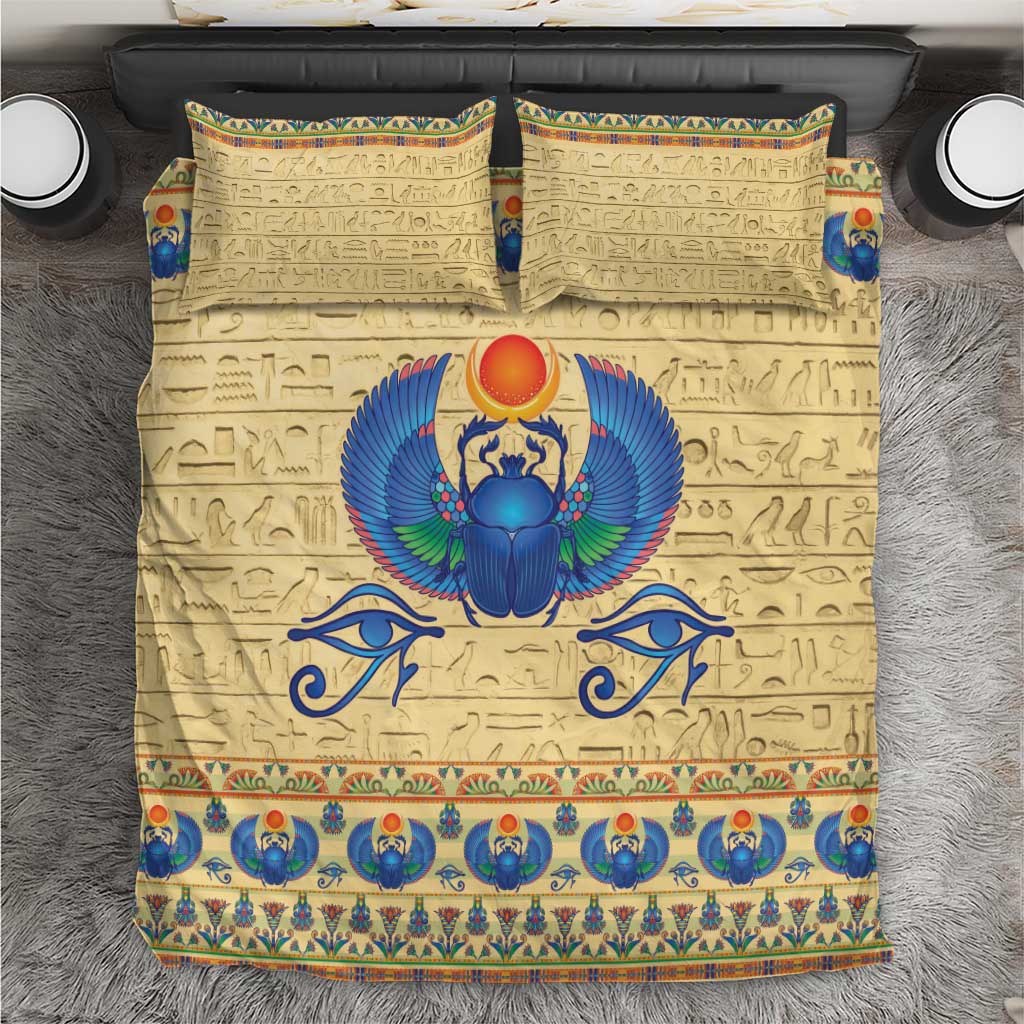Beige Egyptian scarab beetle bedding set with blue winged emblem and hieroglyph pattern