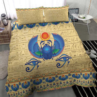 Beige bedspread with blue scarab beetle wings, red sun disk, and blue patterned border