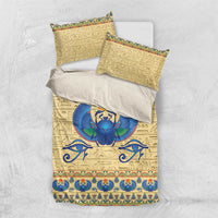 Beige bedding set with pillowcases and duvet, blue scarab beetle emblem and hieroglyph motifs