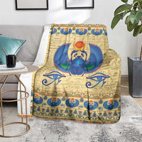 Scarab beetle themed blanket in beige with central blue winged scarab and decorative band