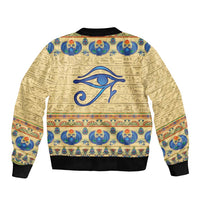 Beige bomber jacket with Egyptian scarab and hieroglyph print, ribbed hem and cuffs