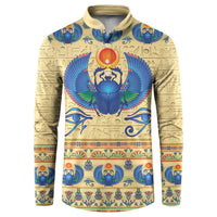 Beige henley sweatshirt with blue Egyptian-style scarab graphic and long sleeves