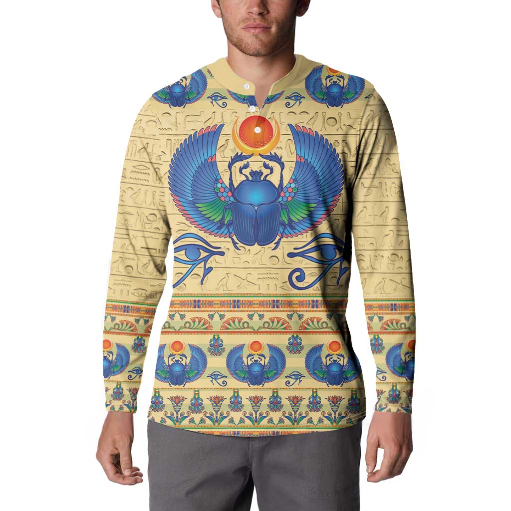 Beige long-sleeve henley sweatshirt with large blue winged scarab front graphic
