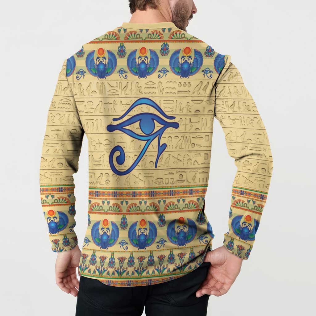 Beige long-sleeve henley sweatshirt with blue eye symbol and Egyptian border on back