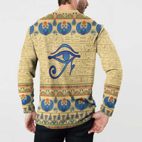 Beige long-sleeve henley sweatshirt with blue eye symbol and Egyptian border on back