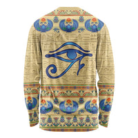 Beige long-sleeve shirt with blue Egyptian eye and scarab pattern on back