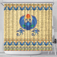 Beige shower curtain featuring blue winged scarab beetle centerpiece and border