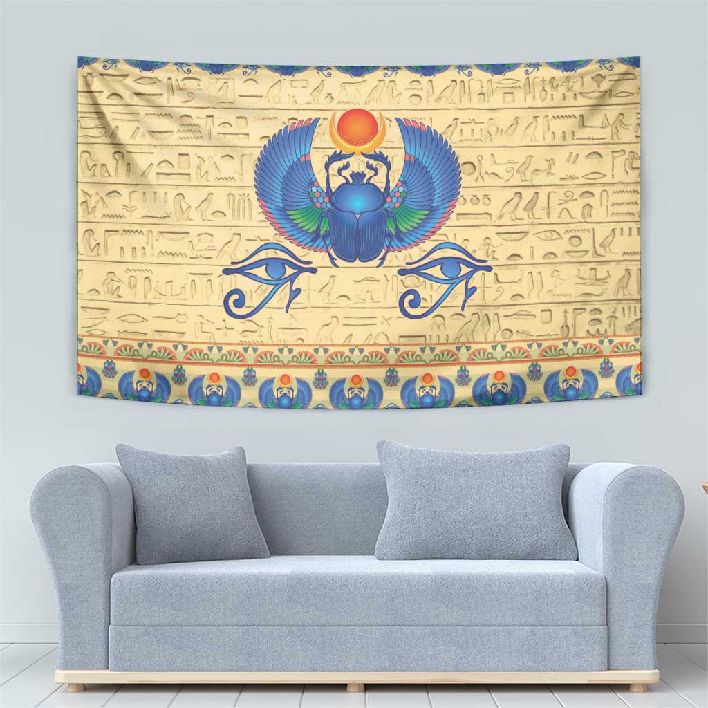 Beige Egyptian tapestry showing a blue scarab beetle with red sun-like emblem above
