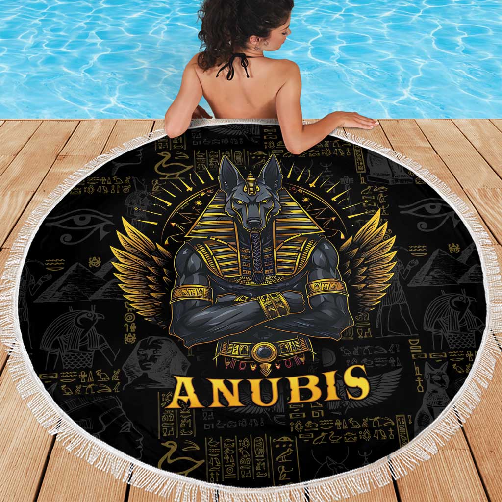 Black round beach blanket with Anubis and gold wings design, white fringe border