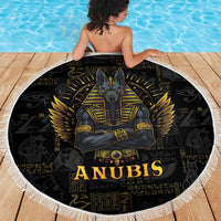 Black round beach blanket with Anubis and gold wings design, white fringe border