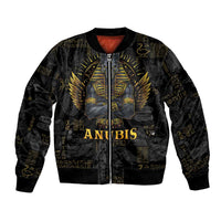 Black bomber jacket with gold Anubis front graphic, ribbed collar, cuffs, and hem