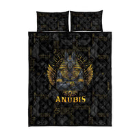 Black quilt bed set showing centered Anubis portrait with gold wings and hieroglyphs