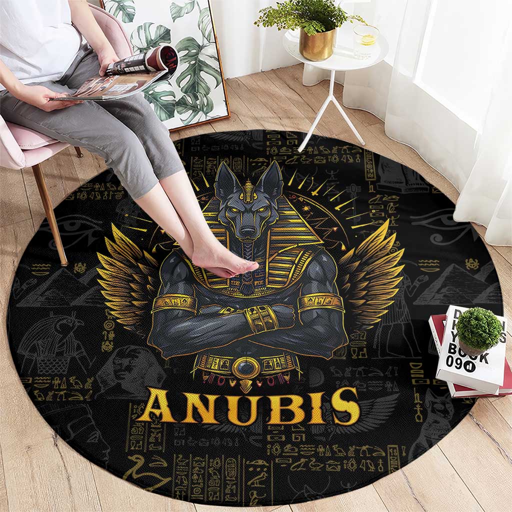 Black round Anubis rug with gold seated god graphic, “ANUBIS” lettering, and hieroglyphs