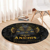 Black round Anubis rug with gold winged god design, “ANUBIS” lettering, and hieroglyphs