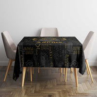 Black Egyptian motif tablecloth on a dining table with draped corners