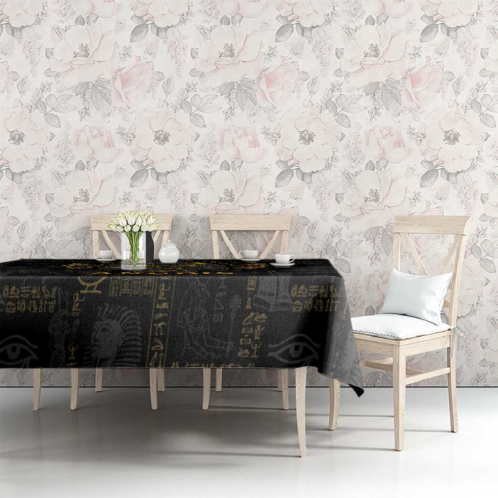 Black rectangular tablecloth with gold hieroglyphs and eye motifs