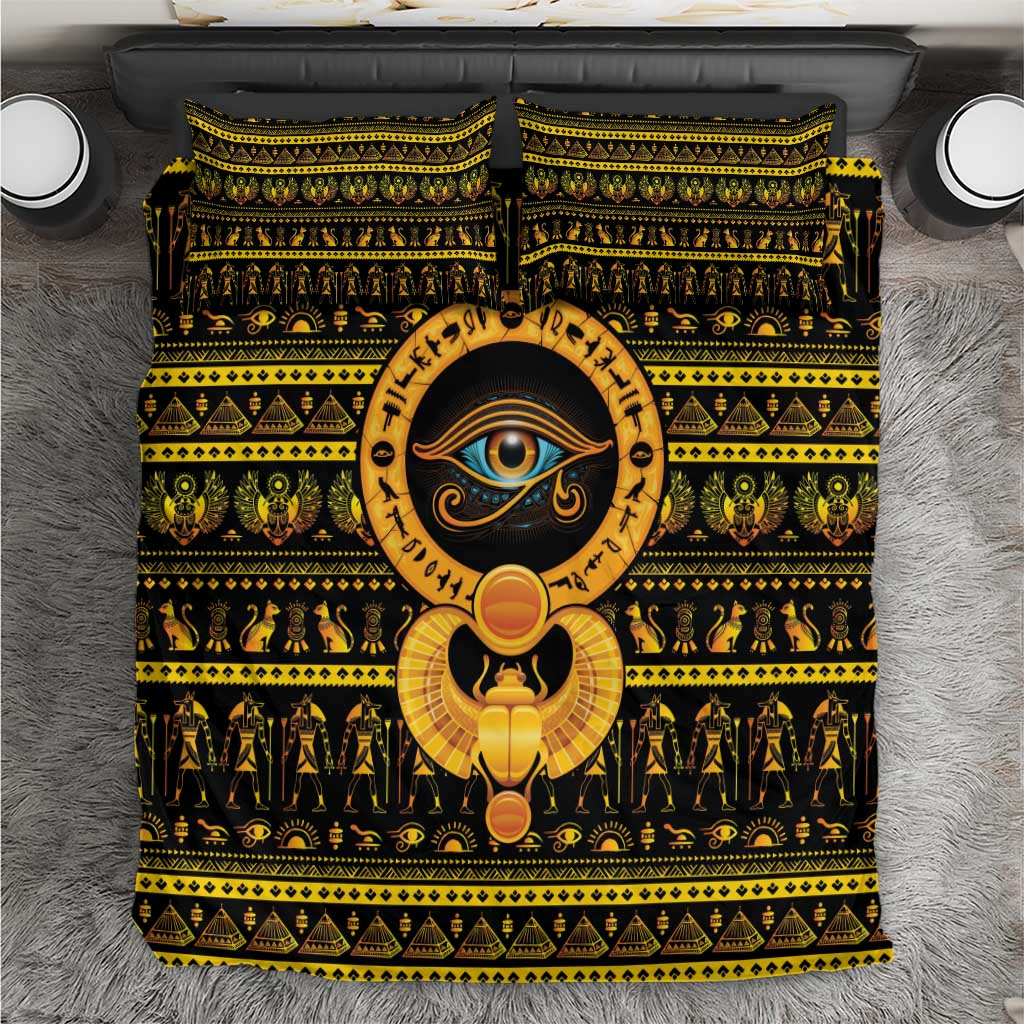 Black bedding set with gold hieroglyph patterns and Eye of Ra graphic on duvet