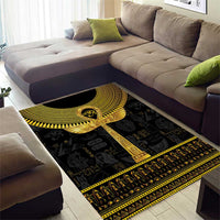 Black and gold Egyptian ankh hieroglyph area rug with bold central cross and border