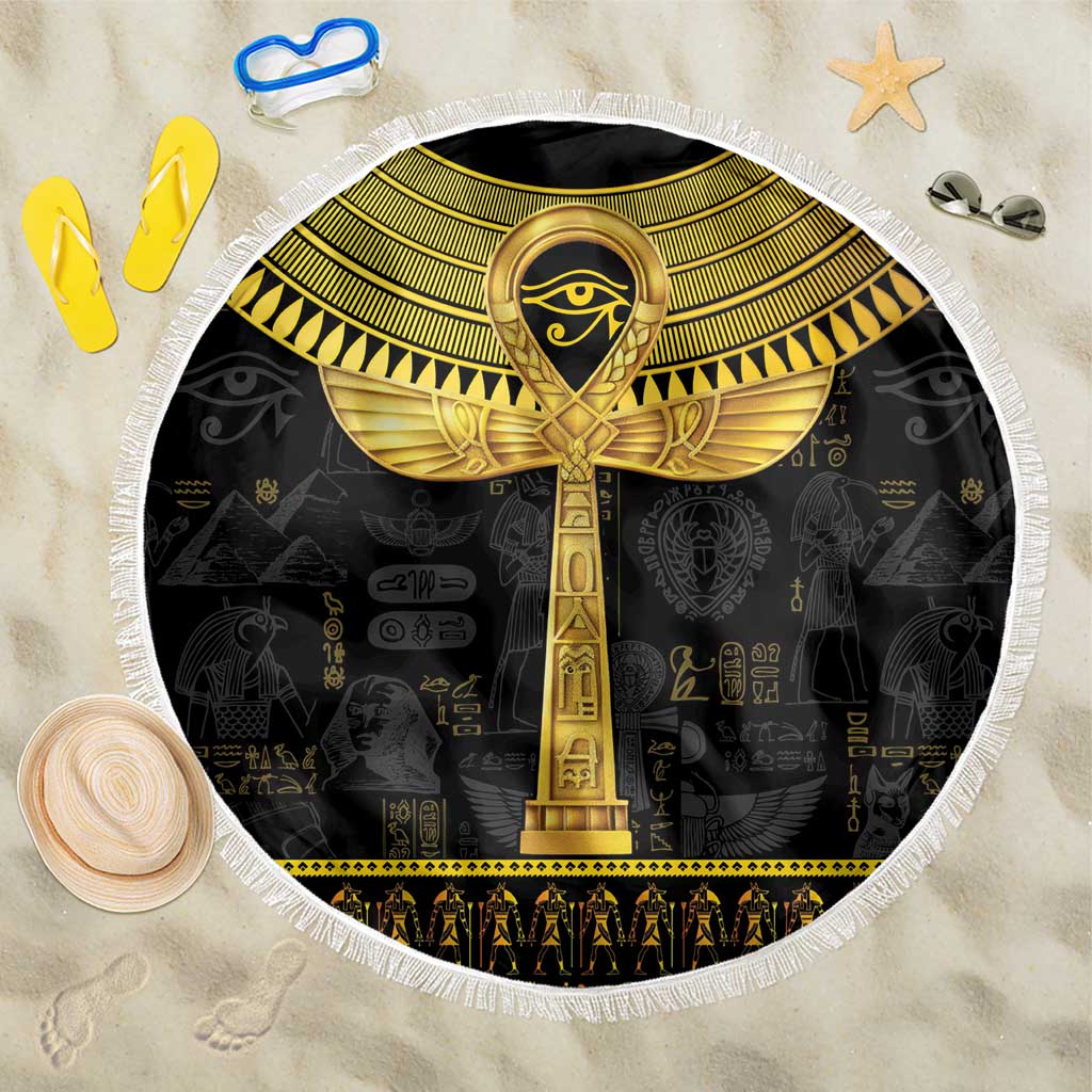 Black round beach blanket with gold ankh hieroglyph center and white fringe edging