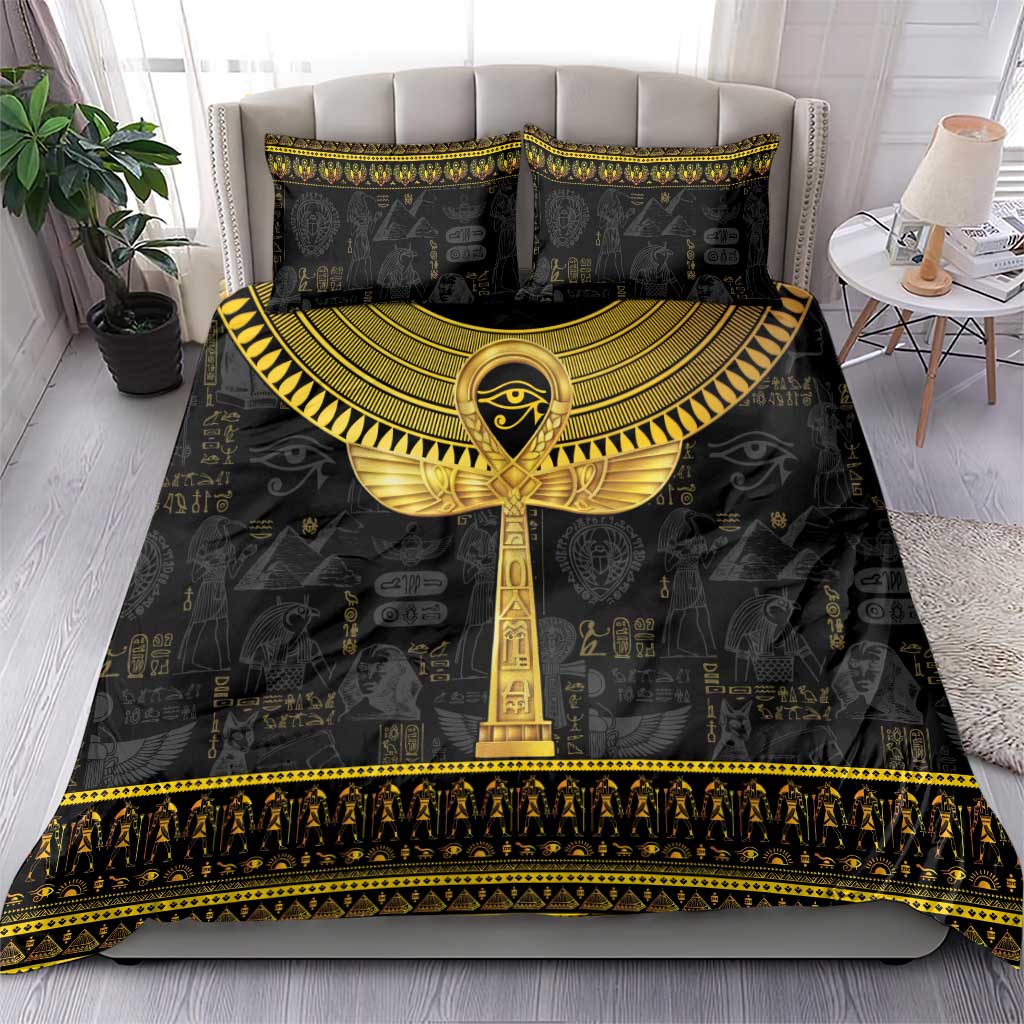 Black bedding set with gold ankh centerpiece on duvet and two matching pillow covers