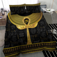 Black duvet and two pillows featuring large gold ankh with winged design and border