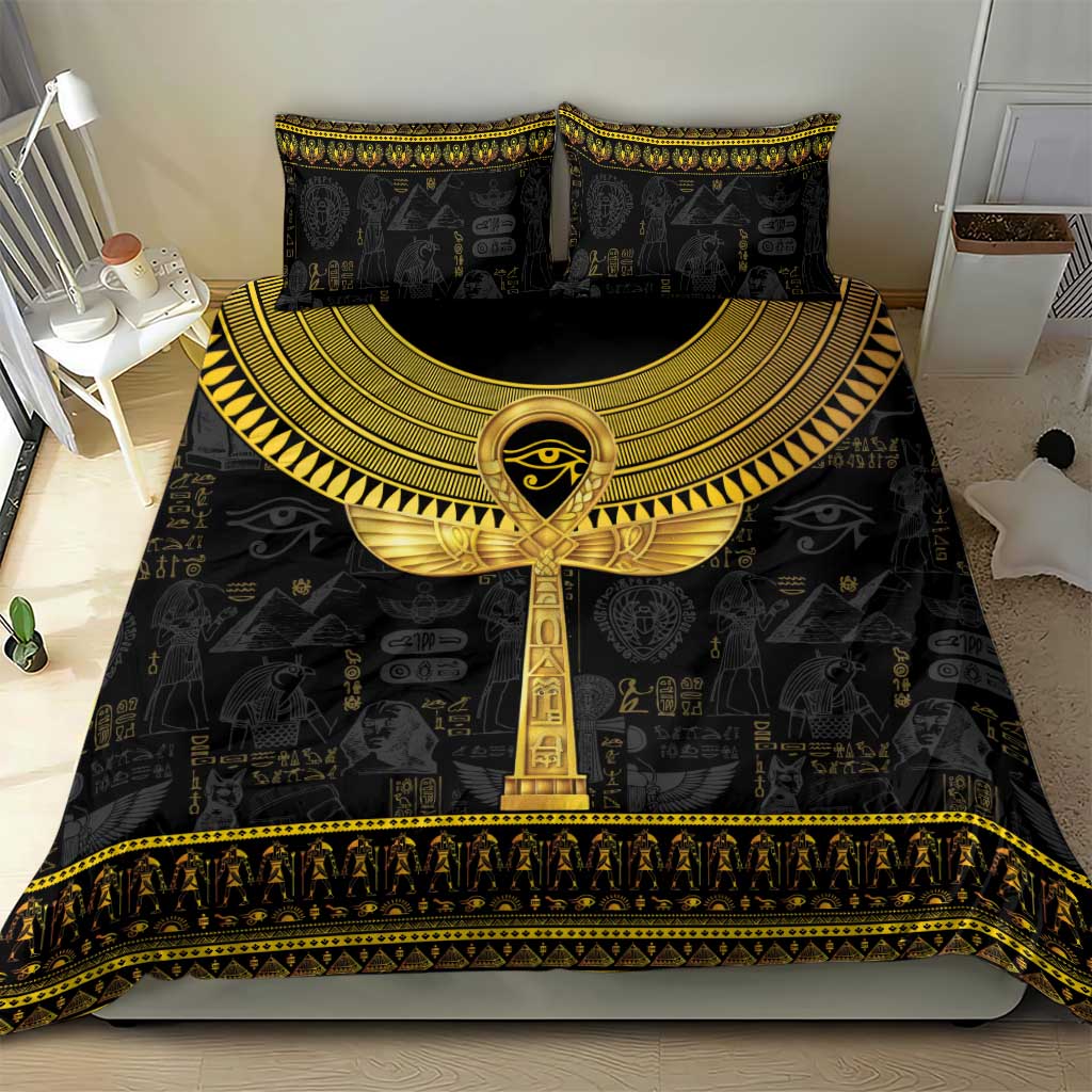 Black bedding set with gold ankh medallion on duvet and striped-gold bottom border
