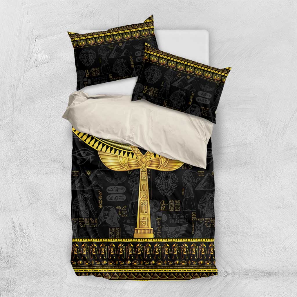 Black bedding set with gold ankh on duvet; included pillowcases shown folded on top
