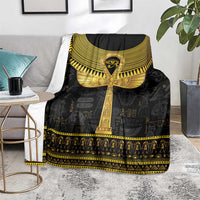 Black Egyptian ankh hieroglyph blanket spread on bed with gold winged emblem and strip border