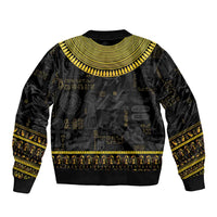 Black bomber jacket with gold hieroglyph print and wide ribbed collar, rib hem