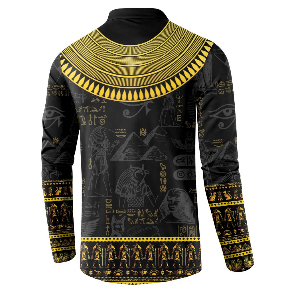 Black sweatshirt with gold collar trim and Egyptian hieroglyph panel print, long sleeves